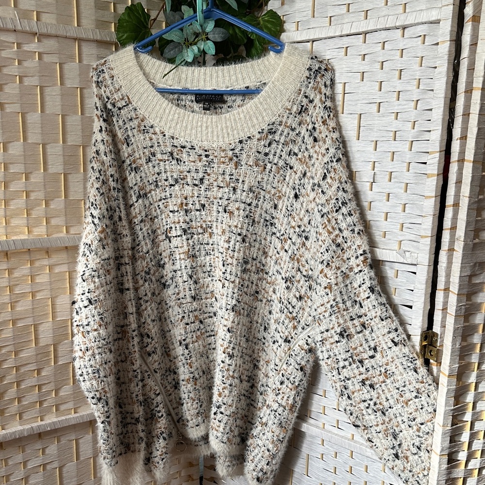 Cream and navy blue and tan Knit Sweater.Zipper’s on both side’s of sweater